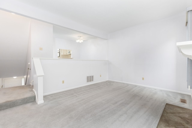 85 Metacomet Dr Unit 85, Meriden, CT 06450 - unfurnished living room with carpet floors, baseboards, and ceiling fan