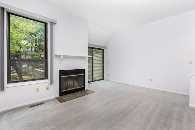 85 Metacomet Dr Unit 85, Meriden, CT 06450 - unfurnished living room with a fireplace with flush hearth, carpet floors, lofted ceiling, and baseboards