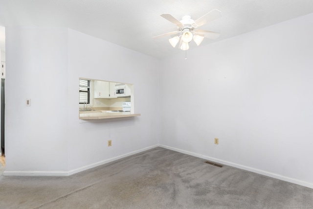 85 Metacomet Dr Unit 85, Meriden, CT 06450 - empty room with carpet, a ceiling fan, a sink, and baseboards