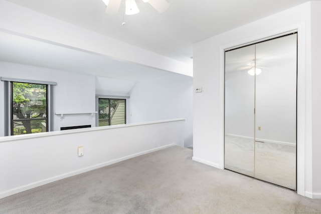 85 Metacomet Dr Unit 85, Meriden, CT 06450 - unfurnished bedroom featuring carpet, multiple windows, a closet, and baseboards