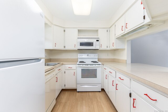 85 Metacomet Dr Unit 85, Meriden, CT 06450 - kitchen with white appliances, open shelves, light wood-style flooring, and light countertops