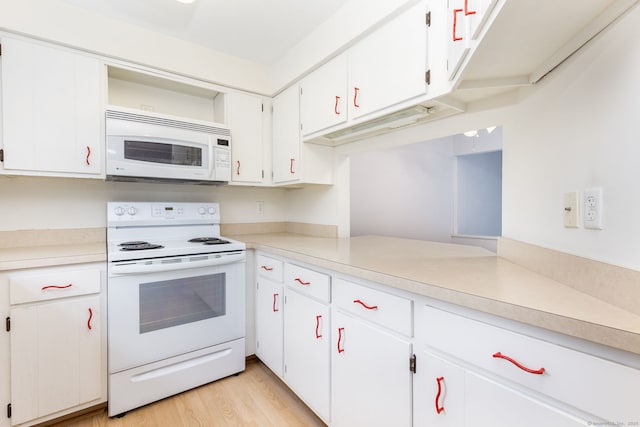 85 Metacomet Dr Unit 85, Meriden, CT 06450 - kitchen with white appliances, light countertops, white cabinets, and light wood-type flooring