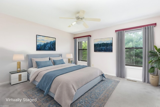 85 Metacomet Dr Unit 85, Meriden, CT 06450 - carpeted bedroom featuring multiple windows, baseboards, and a ceiling fan