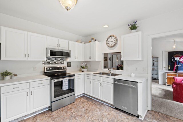 8 Cypress Way, Waterford, CT 06385 - kitchen featuring stainless steel appliances, a sink, white cabinets, and light countertops