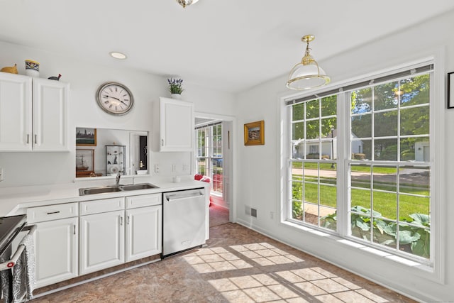 8 Cypress Way, Waterford, CT 06385 - kitchen featuring stainless steel dishwasher, a sink, range, white cabinetry, and light countertops
