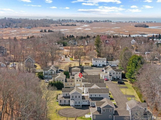 aerial view of property and surrounding area with nearby suburban area
