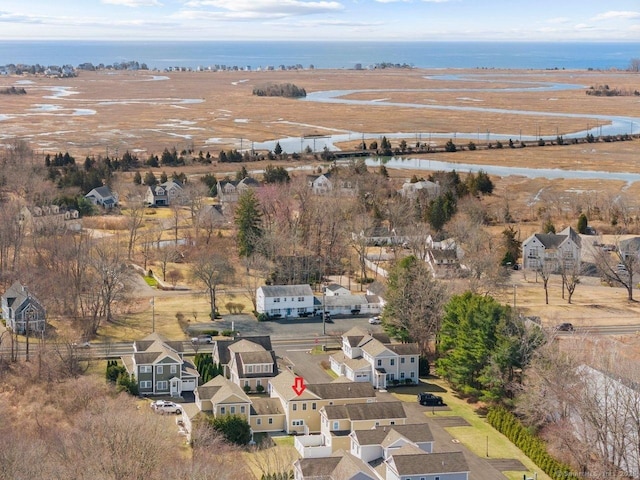 aerial view of property's location with nearby suburban area