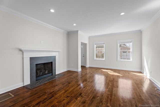 unfurnished living room with a fireplace with flush hearth, wood finished floors, crown molding, baseboards, and recessed lighting