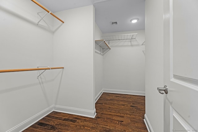 spacious closet with wood finished floors