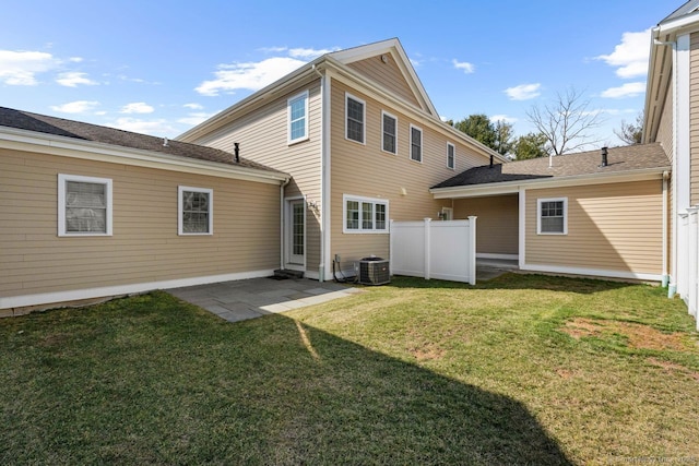 rear view of property with a patio area and central air condition unit