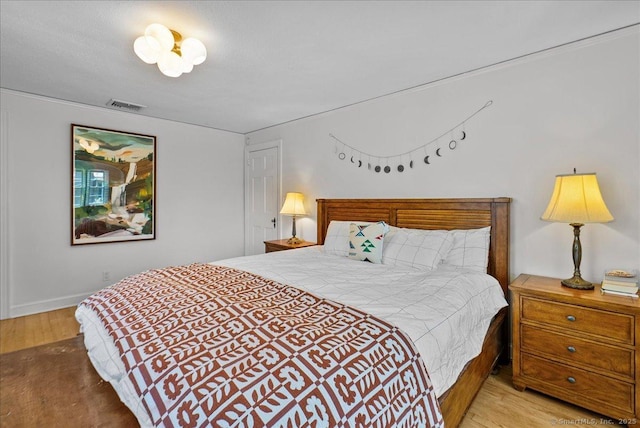 bedroom featuring wood finished floors