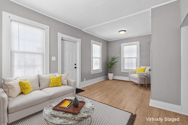 69 Trinity St, New Britain, CT 06051 - living area with light wood finished floors, baseboards, and ornamental molding