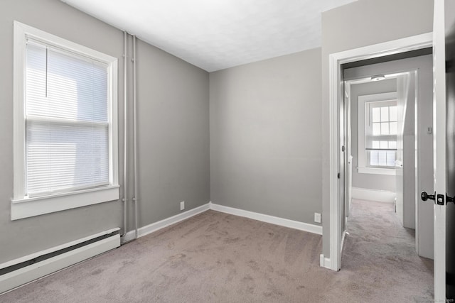 69 Trinity St, New Britain, CT 06051 - carpeted empty room with a baseboard radiator and baseboards