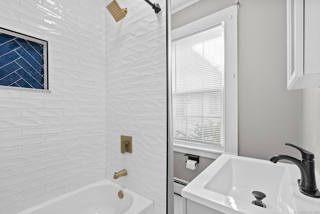 69 Trinity St, New Britain, CT 06051 - full bathroom featuring a sink, shower / washtub combination, and a baseboard heating unit