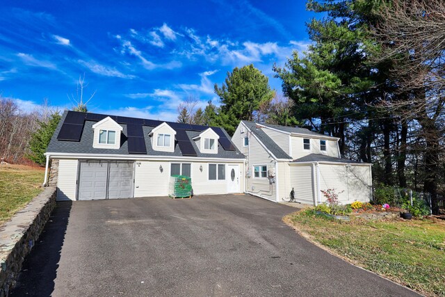 2 Apple Hill Rd, Wolcott, CT 06716 - view of front facade featuring asphalt driveway and roof mounted solar panels