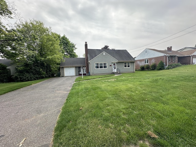 260 W Center St, Southington, CT 06489 - view of front of home featuring asphalt driveway, a front lawn, and a chimney