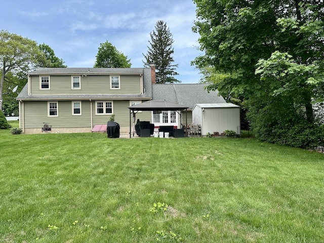 260 W Center St, Southington, CT 06489 - back of property with a lawn, a gazebo, a chimney, and an outbuilding