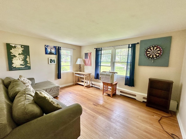 260 W Center St, Southington, CT 06489 - living area featuring light wood-style flooring, baseboards, and baseboard heating