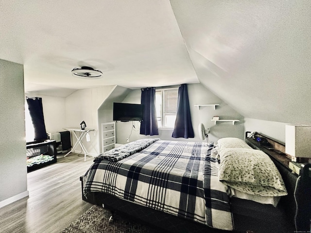 260 W Center St, Southington, CT 06489 - bedroom featuring a textured ceiling, wood finished floors, vaulted ceiling, and baseboards