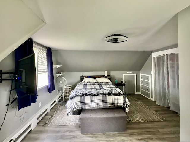 260 W Center St, Southington, CT 06489 - bedroom with baseboard heating, wood finished floors, vaulted ceiling, and baseboards