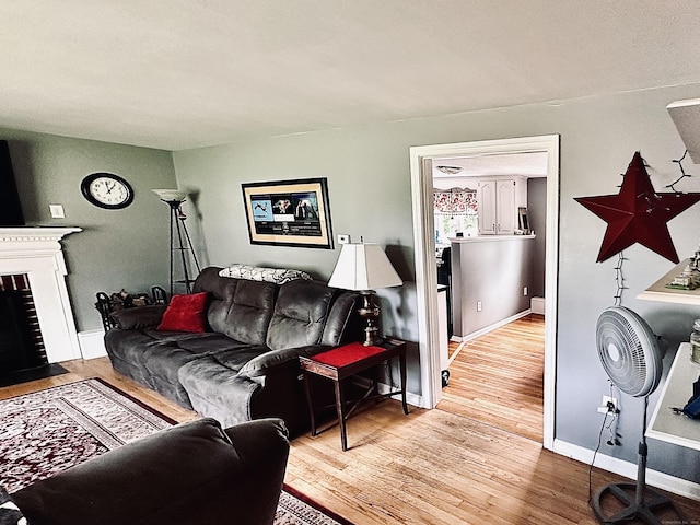 260 W Center St, Southington, CT 06489 - living area with wood finished floors, a fireplace with flush hearth, and baseboards