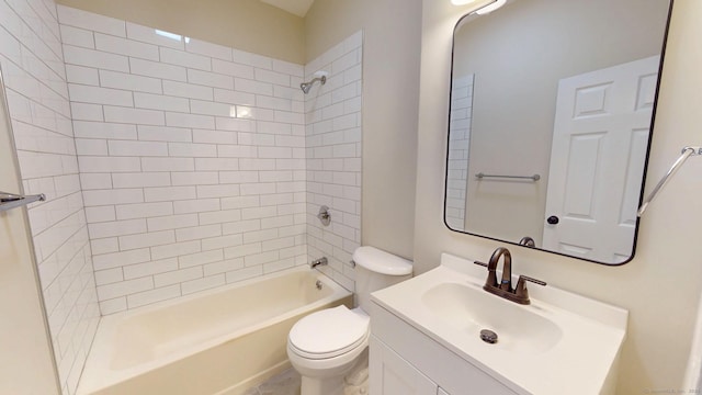bathroom featuring toilet, vanity, and bathing tub / shower combination