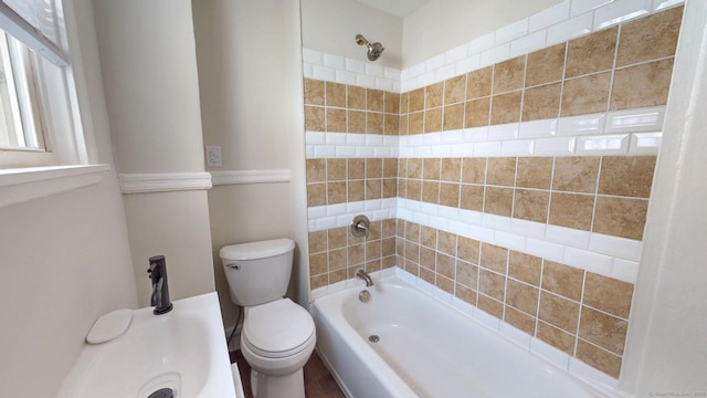 full bathroom featuring toilet and shower / bath combination