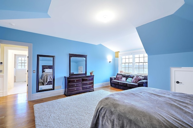 84 Mustang Dr, Monroe, CT 06468 - bedroom with lofted ceiling, wood finished floors, and baseboards