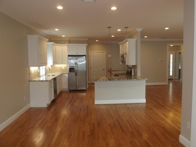 94 Stonehouse Rd Unit 16, Coventry, CT 06238 - kitchen with appliances with stainless steel finishes, a sink, recessed lighting, light stone countertops, and a peninsula
