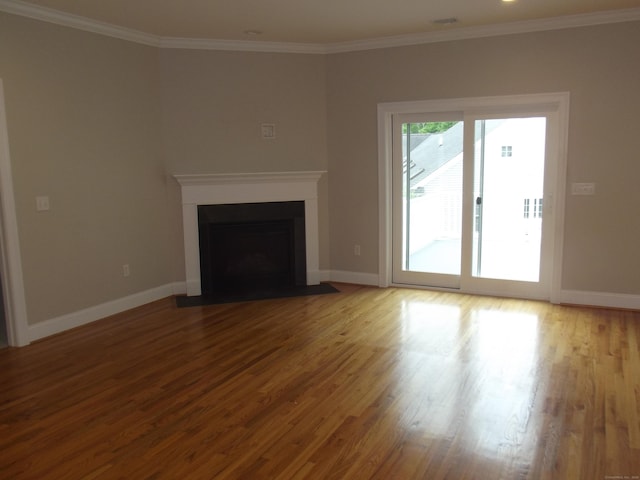 94 Stonehouse Rd Unit 16, Coventry, CT 06238 - unfurnished living room featuring wood finished floors, a fireplace with flush hearth, baseboards, and crown molding