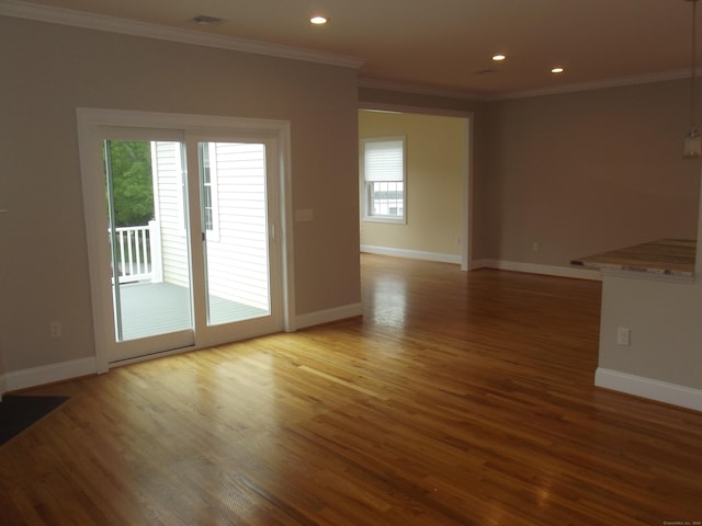 94 Stonehouse Rd Unit 16, Coventry, CT 06238 - empty room with wood finished floors, ornamental molding, baseboards, and recessed lighting