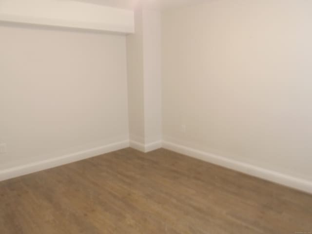 94 Stonehouse Rd Unit 16, Coventry, CT 06238 - empty room featuring wood finished floors and baseboards