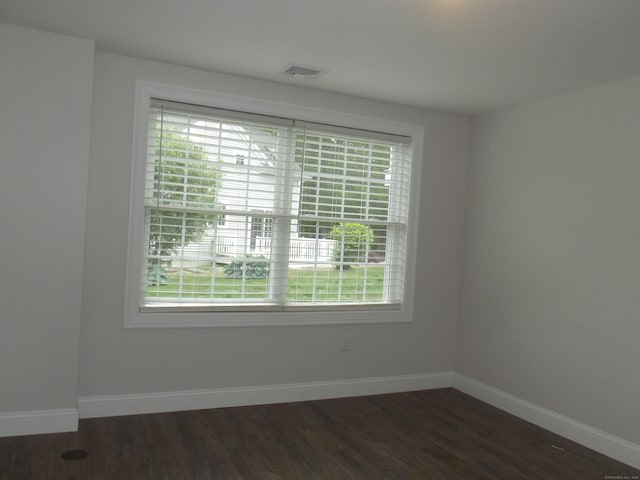 94 Stonehouse Rd Unit 16, Coventry, CT 06238 - unfurnished room featuring healthy amount of natural light, dark wood-style flooring, and baseboards