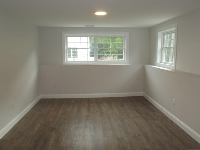 94 Stonehouse Rd Unit 16, Coventry, CT 06238 - empty room with plenty of natural light, dark wood-style floors, baseboards, and recessed lighting