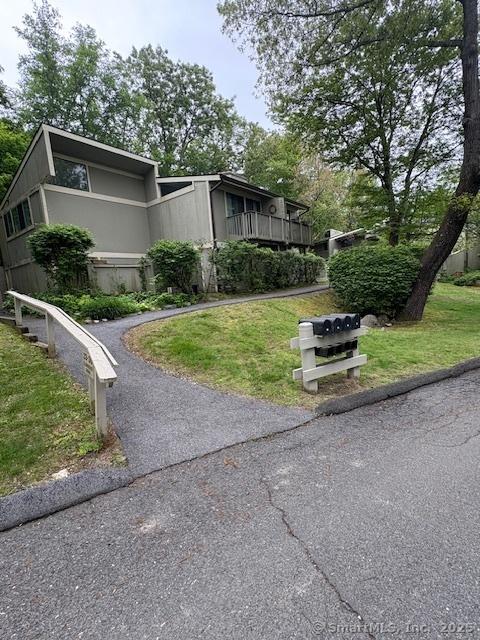 34 Clubhouse Dr Unit 23C, Woodbury, CT 06798 - view of side of property featuring a yard