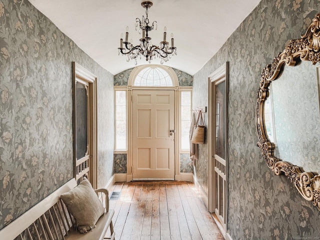 49 Bennett Pond Rd, Canterbury, CT 06331 - entrance foyer featuring light wood-style floors, a chandelier, wallpapered walls, lofted ceiling, and baseboards