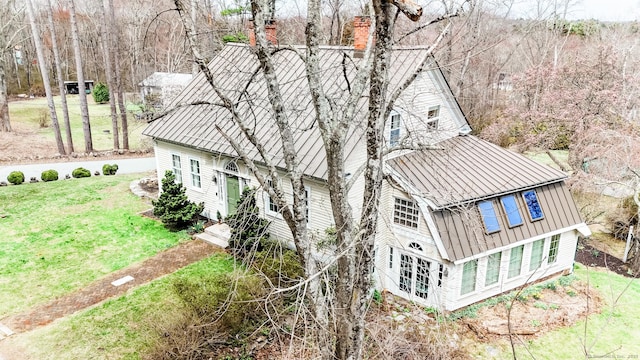 49 Bennett Pond Rd, Canterbury, CT 06331 - back of property featuring a chimney, a lawn, metal roof, and a standing seam roof