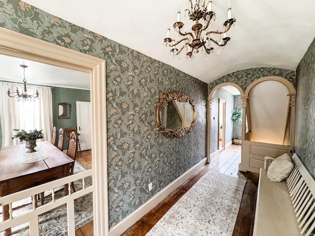 49 Bennett Pond Rd, Canterbury, CT 06331 - corridor with a chandelier, wood-type flooring, arched walkways, lofted ceiling, and baseboards