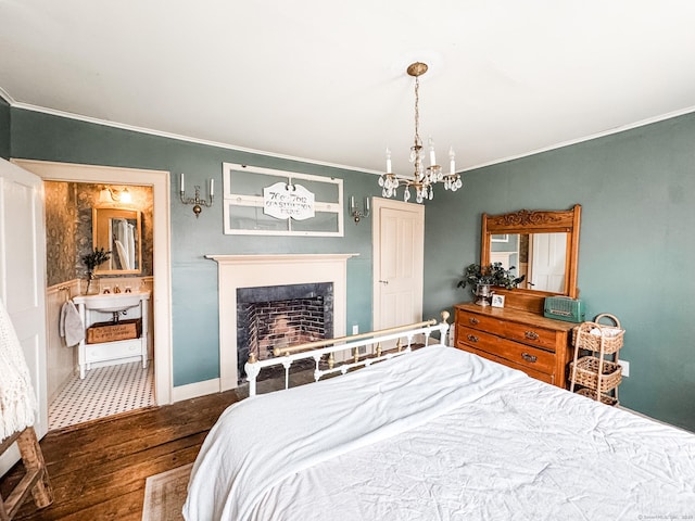 49 Bennett Pond Rd, Canterbury, CT 06331 - bedroom with wood finished floors, ornamental molding, a fireplace, a chandelier, and baseboards