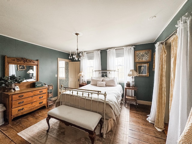 49 Bennett Pond Rd, Canterbury, CT 06331 - bedroom with ornamental molding, dark wood-style flooring, baseboards, and a chandelier