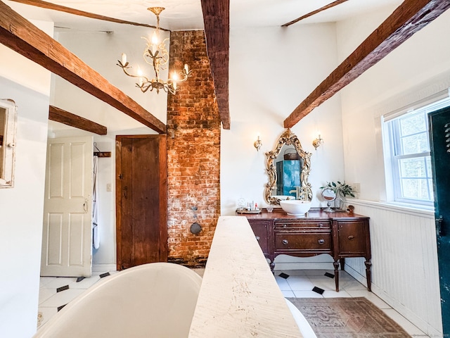 49 Bennett Pond Rd, Canterbury, CT 06331 - full bath featuring high vaulted ceiling, a freestanding tub, a chandelier, vanity, and a wainscoted wall