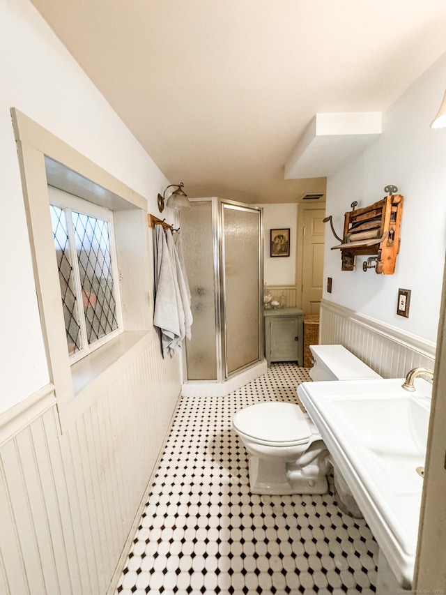 49 Bennett Pond Rd, Canterbury, CT 06331 - full bath featuring a stall shower, wainscoting, toilet, and tile patterned flooring