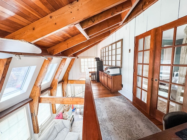49 Bennett Pond Rd, Canterbury, CT 06331 - unfurnished living room featuring french doors, wood ceiling, wood finished floors, wooden walls, and a skylight