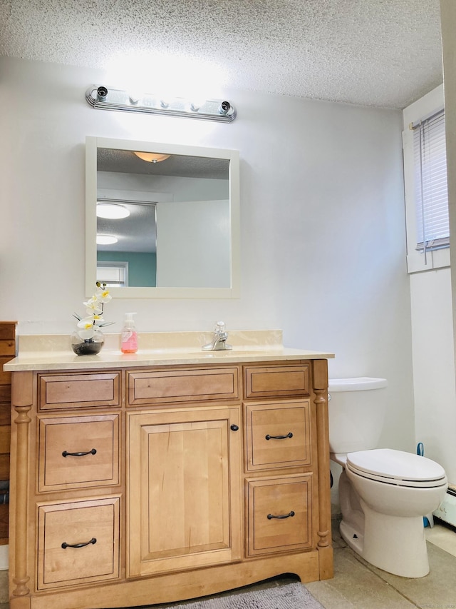 67 S Beechwood Rd, East Lyme, CT 06357 - bathroom with toilet, vanity, and a textured ceiling