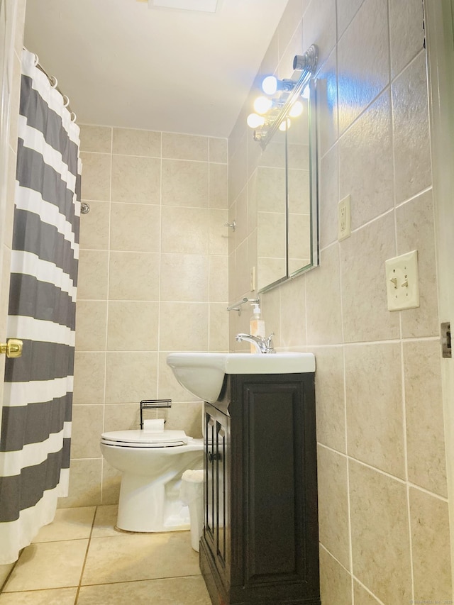 67 S Beechwood Rd, East Lyme, CT 06357 - bathroom with tile walls, toilet, vanity, tile patterned flooring, and a shower with shower curtain