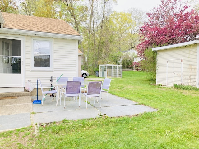 67 S Beechwood Rd, East Lyme, CT 06357 - view of green lawn with a patio and outdoor dining space