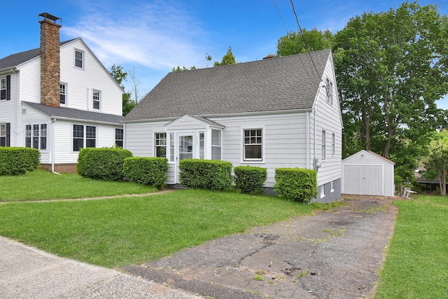 145 Westminster St, Hamden, CT 06518 - view of front of home featuring a storage unit, an outdoor structure, and a front yard