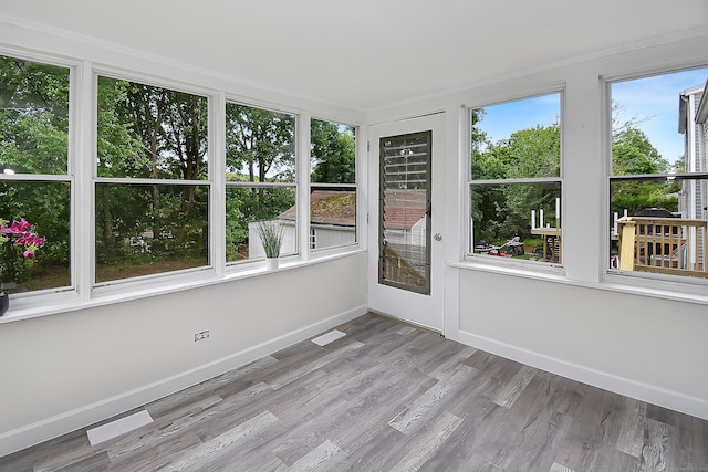 145 Westminster St, Hamden, CT 06518 - unfurnished sunroom with baseboards, wood finished floors, and ornamental molding