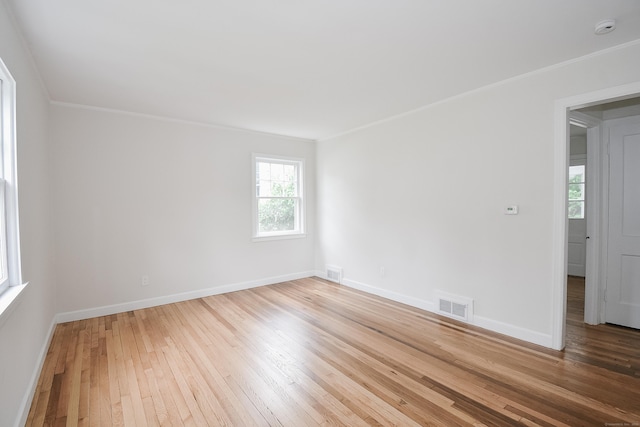 145 Westminster St, Hamden, CT 06518 - spare room featuring hardwood / wood-style flooring, crown molding, plenty of natural light, baseboards, and a smoke detector