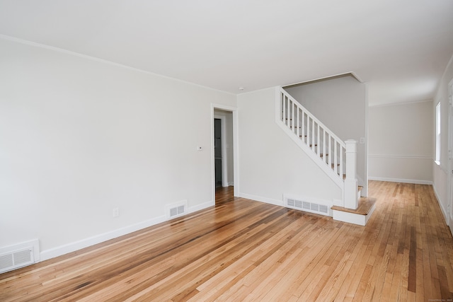 145 Westminster St, Hamden, CT 06518 - unfurnished room featuring ornamental molding, stairs, light wood-style flooring, and baseboards